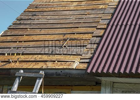 Outdoor Sunny Day Cropped Shot Of An Old Building Reroofing, No People