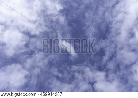 Blue Sky Background With White Fluffy Cumulus Clouds. Panorama Of White Fluffy Clouds In The Blue Sk