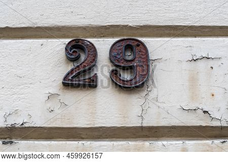 Number Twenty Nine On Peeling Wall By Doorway
