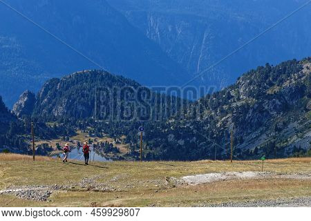 Chamrousse, France, August 11, 2022 : Hikers On The Paths Over Lac Achard, A Famous Destination For 