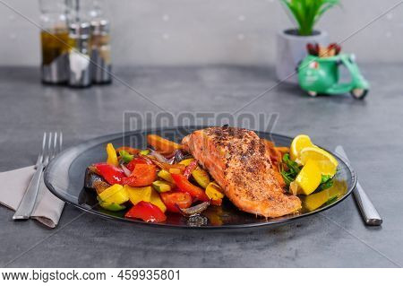 Fresh Roasted Vegetables And Roasted Salmon With Gray Background