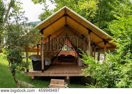 Glamping Tent In The Forest. Luxury Tent. Nature Green Tourism. Glamping Tent Set In Woodlands.  Lux