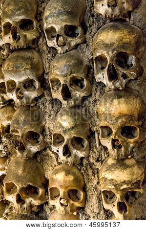 Wall full of skulls and bones in the bone chapel in Evora, Portugal