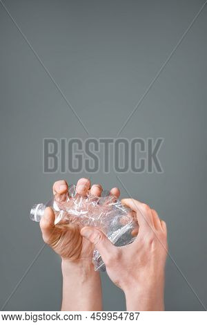 Raised Hands Holding Crumpled Plastic Bottle Hand Squeeze Bottle Water Plastic Recycle Reuse Reduce 