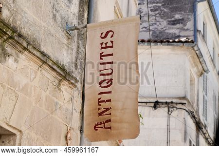 Antiquites Store Entrance Panel In The Street With Retro Text Antiques In French Translation Means I