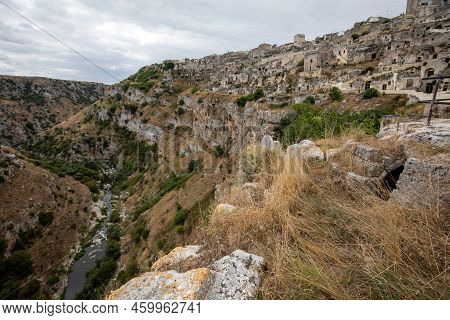 View Of Gravina River Canyon And Park Of The Rupestrian Churches Of Matera With Houses In Caves Di M