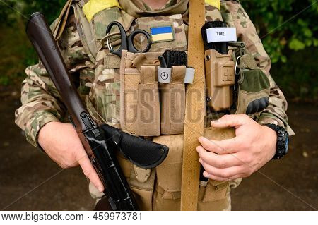 Military Ammunition On A Ukrainian Soldier With An Assault Rifle Ak 74, Bulletproof Vest And Medical