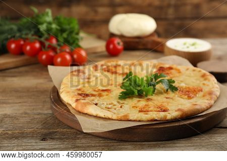Delicious Khachapuri With Cheese On Wooden Table