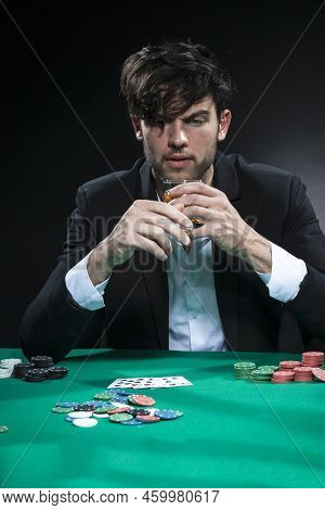 Frustrated Handsome Caucasian Brunet Young Pocker Player At Pocker Table With Chips And Cards While 