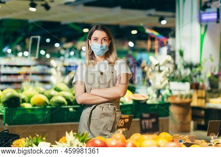 Portrait Young Woman Worker Seller In A Vegetable Section Supermarket Standing In A Protected Face M