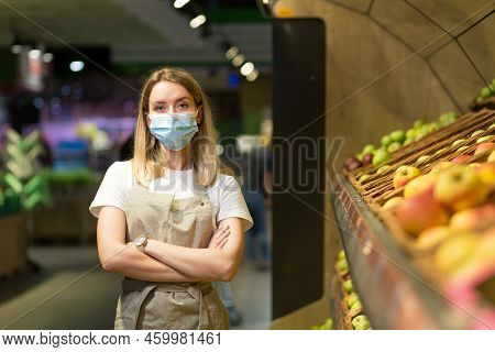 Portrait Young Woman Worker Seller In A Vegetable Section Supermarket Standing In A Protected Face M