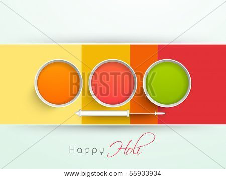Indian color festival Holi background with buckets with full of colours and pichkari (colour gun) on stripes background. 