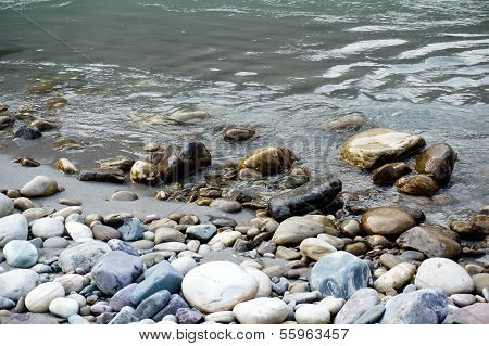 Smooth Round Stones On Riverside In Rishikesh