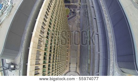 Walls of tall office buildings with many windows. View from unmanned quadrocopter