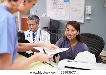 Medical Staff Meeting At Nurses Station