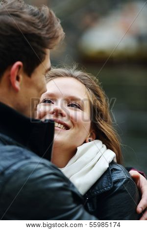 Lovely couple enjoying fall in love at park