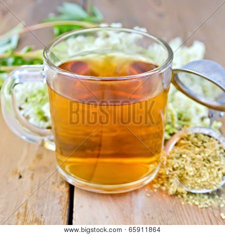 Herbal Tea From Meadowsweet Dry In Mug With Strainer