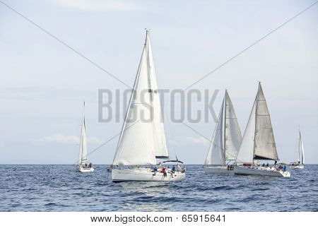 AEGEAN SEA, GREECE - APR 27, 2014: Unidentified sailboats participate in sailing regatta 