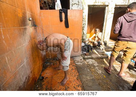 KATHMANDU, NEPAL - DEC 3, 2013: Unidentified local people during the cremation ceremony along the holy Bagmati River in Bhasmeshvar Ghat at Pashupatinath temple in Kathmandu.