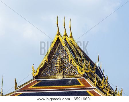 BANGKOK, THAILAND - JUNE 5, 2012: famous temple Phra Sri Ratana Chedi covered with foil gold in the inner Grand Palace