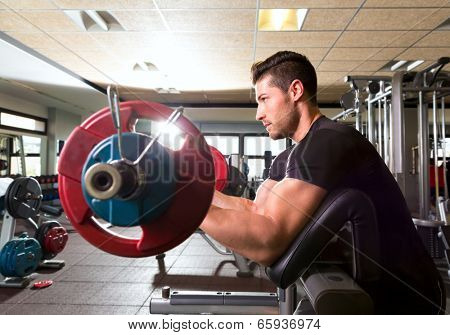 biceps preacher bench arm curl workout man at fitness gym