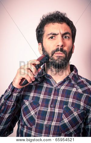 young man with strage expression when cut his beard and moustach