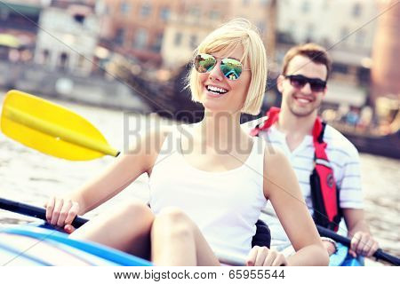 A picture of a young couple in a canoe sightseeing Gdansk in Poland