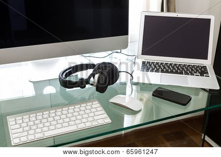 Modern home office with computer and labtop