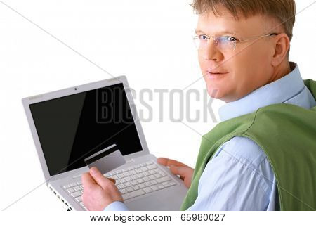 A man sitting with a laptop, holding a credit card