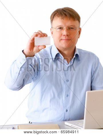 A man sitting with a laptop, holding a credit card