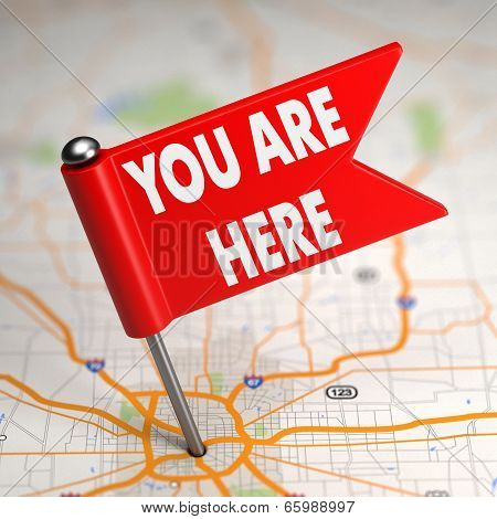 You Are Here - Small Flag on a Map Background