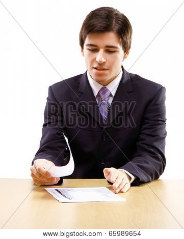 young business man on a desk, isolated on white
