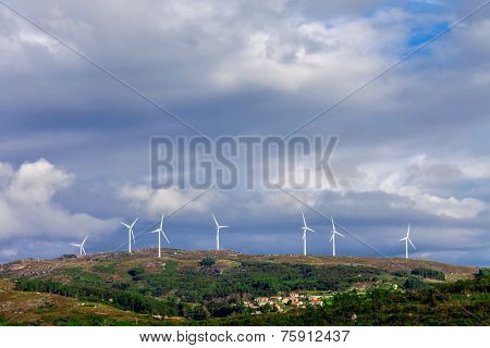 Wind turbine generators on top a hill for the production of clean and renewable energy near Fafe, Portugal