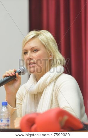NOVOSIBIRSK, RUSSIA - NOVEMBER 8, 2014: World champion in boxing Natalia Ragozina talk with children. The meeting dedicated to the Friendship Cup and aimed to promote the sport