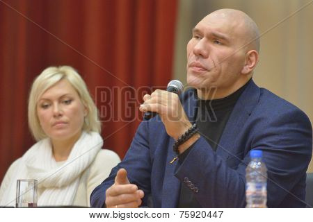 NOVOSIBIRSK, RUSSIA - NOVEMBER 8, 2014: World champions in boxing Nikolay Valuyev and Natalia Ragozina talk with children. The meeting dedicated to the Friendship Cup and aimed to promote the sport