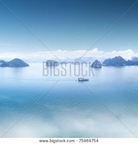 Blue water and sky aerial view panorama of Halong Bay in Vietnam. Scenic background landscape 