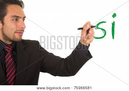 young handsome businessman writing on whiteboard with marker