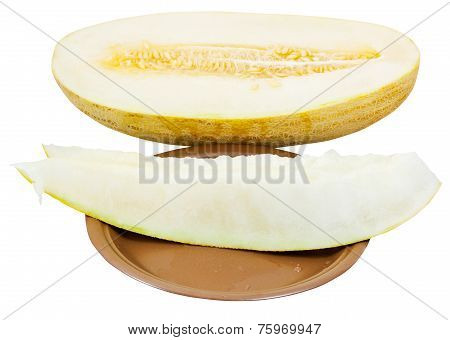 Two Slices And Uzbek-russian Melon On Plate