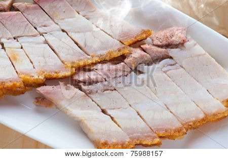 Close up Chinese roasted pork. Singapore cuisine. Fresh cooked with hot steam and smoke.