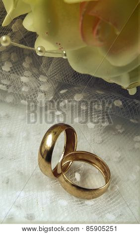 Gold Wedding Rings With A Bridal Bouquet.