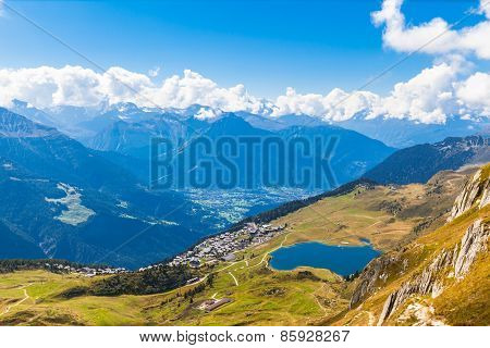 Bettmersee (lake) And The Alps In Valais