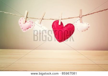 Small Hearts With Stitches Hanging On A String