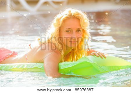 Woman swims with airbed