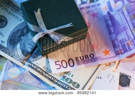 present box and money - dollar and euro