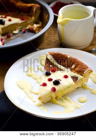 pudding with frozen berries and vanilla sauce