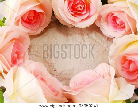 beautiful roses flower on paper texture background with filters color and space for copy