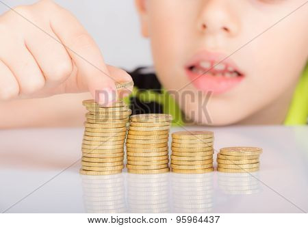 young boy counting his coins