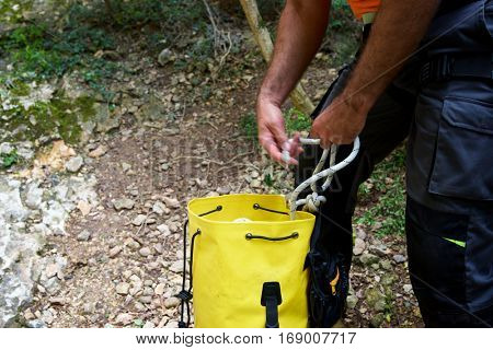Picking up the backpack in Guara Mountains, Huesca, Aragon, Spain.