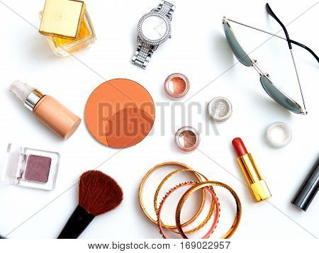 cosmetics top view on a white table. Workplace women cosmetic bag