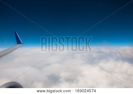 Fly over the clouds, through the airplane.
